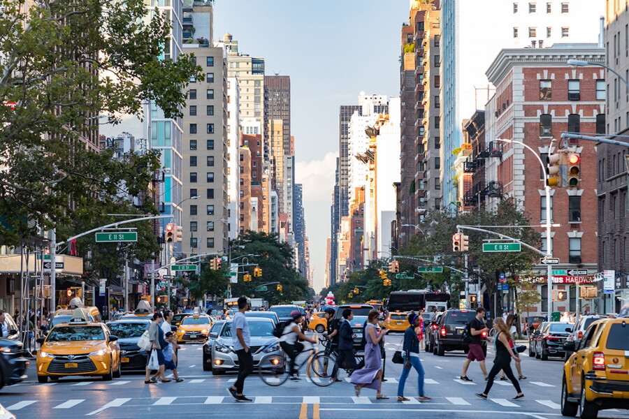 New York avenue with yellow taxis and pedestrians